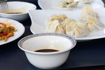 Steamed Delights: Fluffy Uyghur Momo Served with Soy Sauce