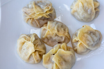 Steamed Delights: Fluffy Uyghur Momo Served with Soy Sauce