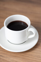 cup of coffee on a wooden table