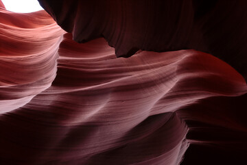 A wavy red sandstone wall. The photo was taken in Arizona, USA