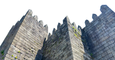 Medieval fortress walls of Guimaraes Castle in Portugal, isolated on white background. The stone