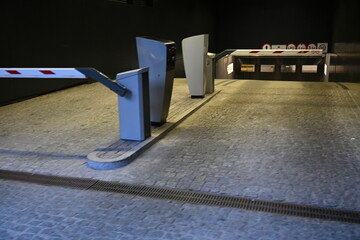 barriers at the entrance to an underground parking
