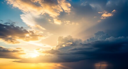 Obraz premium Dramatic Sunset Sky with Golden Rays Breaking Through Dark Clouds.