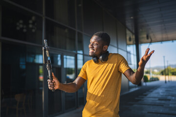 Excited influencer creating content with smart phone gimbal