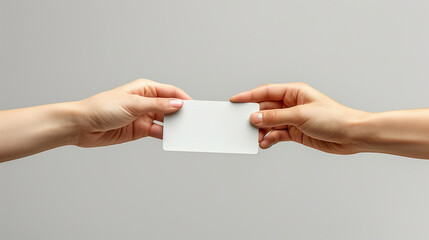 business card exchanged between two hands symbolizes networking and professional connections. Space for text.