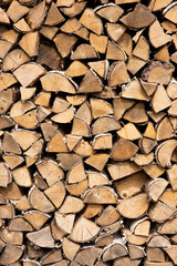 Neatly stacked stack of firewood, firewood for the fireplace, firewood, raw materials, wood rental, calorific value