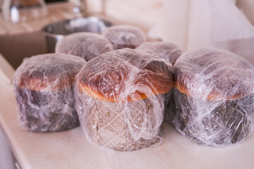 Moscow, Russia, 18.04.25. A group of pastries are covered in plastic wrap