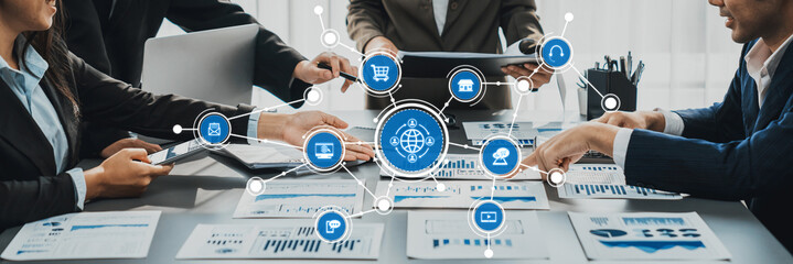 Dynamic business meeting showcasing a diverse team engaged in digital marketing strategies, analyzing reports, and discussing innovative growth opportunities in an office setting. Amity