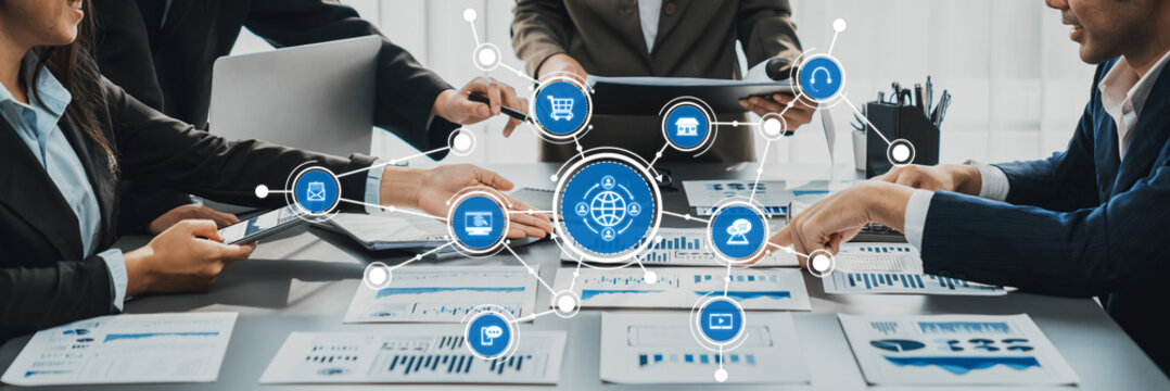 Dynamic business meeting showcasing a diverse team engaged in digital marketing strategies, analyzing reports, and discussing innovative growth opportunities in an office setting. Amity - Powered by Adobe