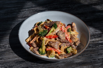 Pasta with beef, mushrooms and vegetables. 