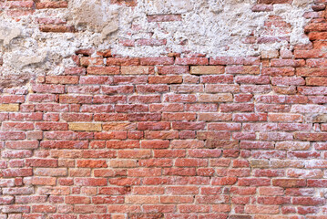 Rustic brick wall texture with warm earthy tones, weathered surface, and natural imperfections, ideal for backgrounds, vintage projects, or architectural design