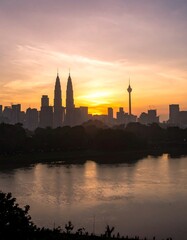 City skyline at sunrise over a river