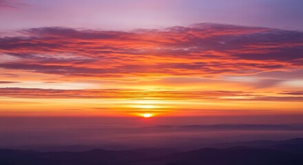 Fototapeta premium Fiery Sunset - A Breathtaking Sky of Vibrant Colors.