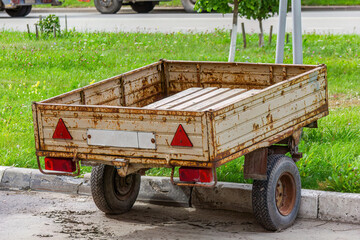 Rusty Trailer on Green Grass