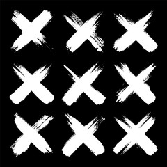 Obraz premium Grunge crosses, brush strokes, x mark, lines, ink smudges, hand-drawn scribble shapes. Handmade sketchy marks, acrylic stains, charcoal streaks. Paint textures, dry brush effect. Vector illustration