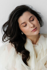 Serene Portrait of a Young Woman in Cream