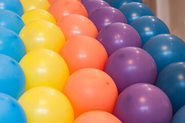 Colorful balloons decoration in vibrant rainbow tones, festive party background