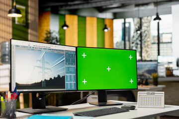 Isolated screen PC in empty engineering office used to refine transmission tower systems, improving...