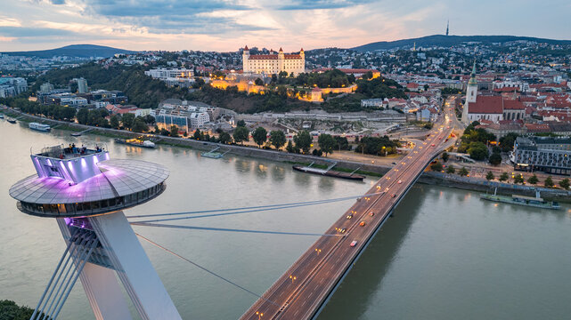 Sunset view of SNP bridge and panorama of Bratislava, Slovakia
