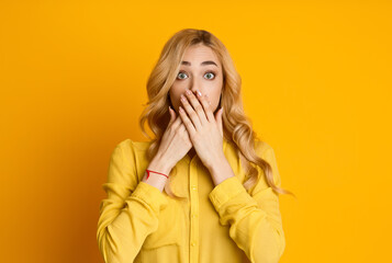 Can't Say Anything. Girl Close her Mouth with Crossed Palms on Yellow Background