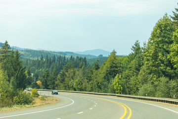 Through fog, forests, and open stretches, Highway 18 carries drivers toward the Oregon coast.