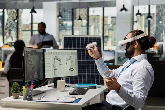 Engineer uses VR headset to optimize sustainable solar panel fabrication with advanced assembly lines. Clean energy expert innovates solar manufacturing processes using virtual reality simulation