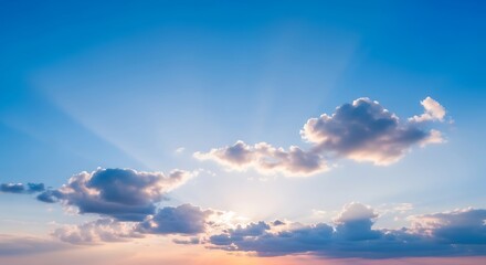 Sky with clouds and sun rays during the day.