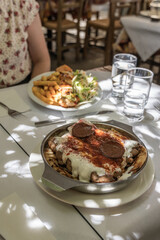 Traditional greek food served in athens restaurant with pita bread, meatballs, yogurt and spices. ...