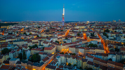 Fototapeta premium Sunset view of Zizkov TV tower overlooking Prague, Czech republi