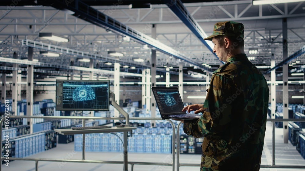 Poster soldier in engineering role uses ai application on laptop to manage server hub systems. army command