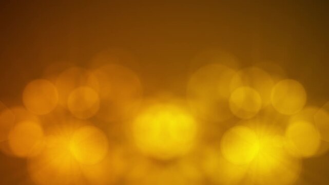 Golden Dust Particles Floating in Light on Dark Background	