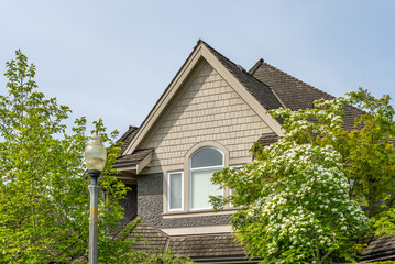 Top of luxury house with shingle roof and nice windows in Summer in Vancouver, Canada, North America. Day time on August 2025.