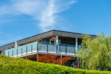 Top of luxury house with shingle roof and nice windows in Summer in Vancouver, Canada, North...