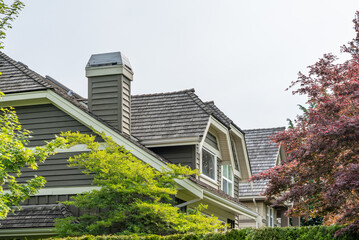 Top of luxury house with shingle roof and nice windows in Summer in Vancouver, Canada, North...