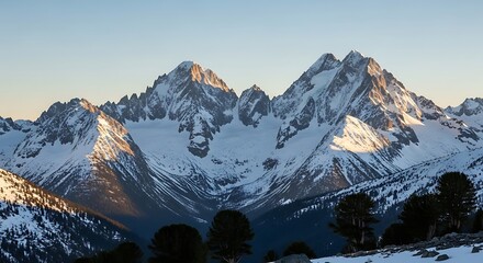 Majestic snow-covered mountain peaks under a clear blue sky.