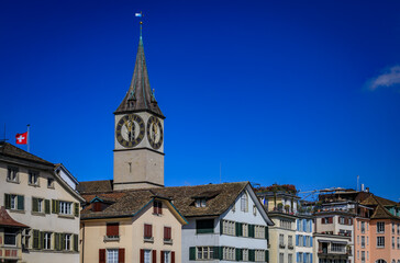 Iconic St. Peter s Church, historic buildings on the Limmat, Zurich, Switzerland