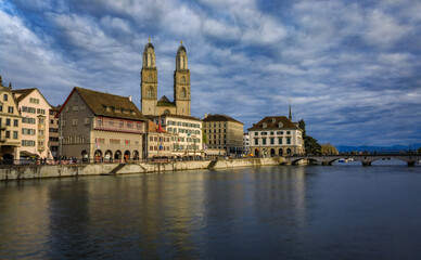 Zurich Cityscape with Limmat River and iconic Grossmunster cathedral Switzerland