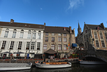 Canal Boats docked along Rozenhoedkaai on a Summer Day - Bruges, Belgium