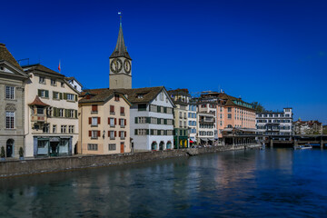 Iconic St. Peter s Church, historic buildings on the Limmat, Zurich, Switzerland