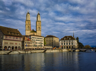Fototapeta premium Zurich Cityscape with Limmat River and iconic Grossmunster cathedral Switzerland
