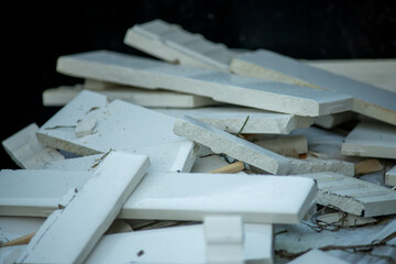Scraps of discarded white bathroom tile