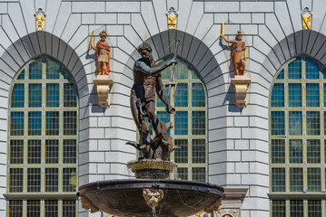 Neptune fountain in front of Artus court in Gdansk, Poland © dudlajzov