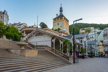 Obraz premium Sunset view of palace tower and market colonnade in Karlovy Vary