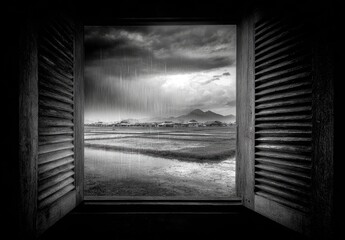 Rainy village view through old wooden window