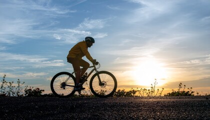 Fototapeta premium Cyclist Silhouette Against Sunset