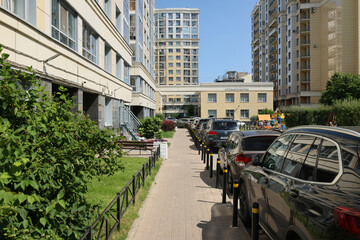 Obraz premium Urban Living Embracing Modern Architecture while Integrating Green Spaces into Our City Life