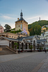 Fototapeta premium Sunset view of castle tower and market colonnade in Karlovy Vary