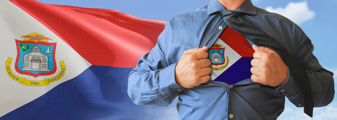 A businessman opening his shirt like super hero with Sint Maarten flag and shows how patriotic he...
