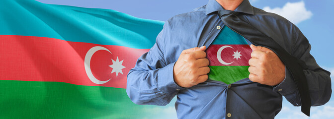 A businessman opening his shirt like super hero with Azerbaijan flag and shows how patriotic he is...