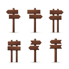 Collection of various wooden signposts with arrows pointing in different directions.